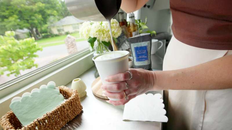 Paige pours coffee