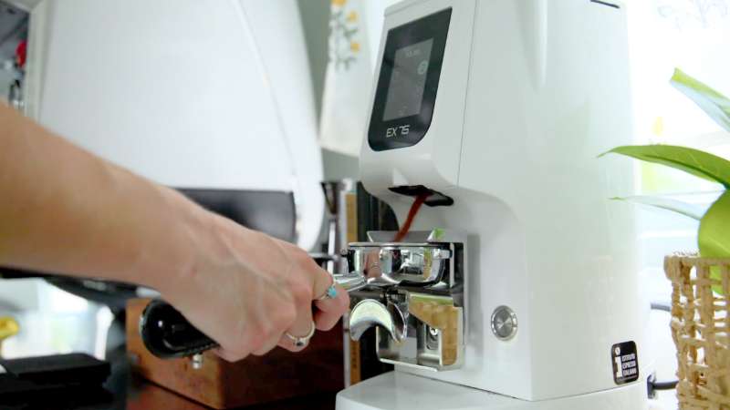 Coffee grinder in use